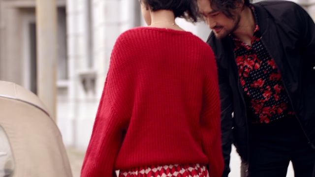 Video Reference: Clothing, Red, Outerwear, Sweater, Fashion, Neck, Street fashion, Sleeve, Shoulder, Cardigan