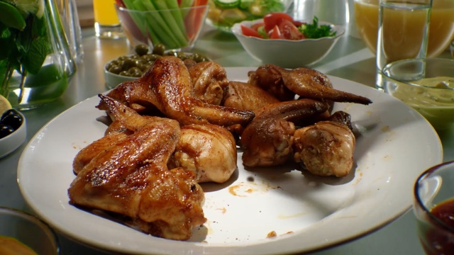Video Reference: dish, food, fried food, cuisine, animal source foods, appetizer, kai yang, meat, meal, roasting, Person
