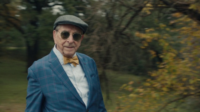 Video Reference: Eyewear, Suit, Glasses, Sunglasses, Formal wear, Outerwear, Cool, Tree, Headgear, Vision care