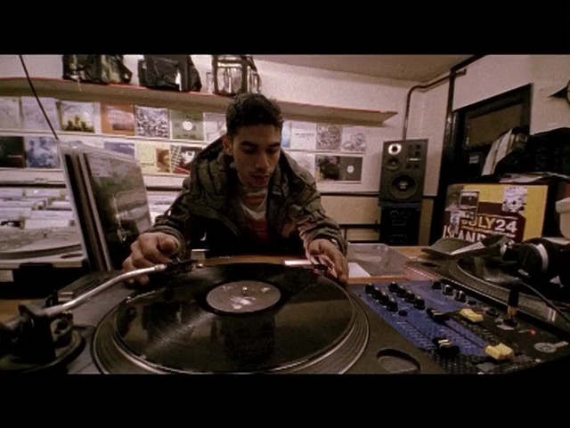 Video Reference: audio engineer, musical instrument accessory, pc game, electronic device, screenshot, musical instrument, electronic instrument, tom tom drum, disc jockey, percussion, Person