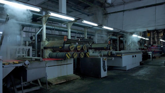 Video Reference: Factory, Machine, Industry, Toolroom, Building, Mass production, Metal, Steel, Person, Indoor, Sitting, Large, Table, Room, Filled, Truck, Cart, Parked, Kitchen, Standing, Man, Commercial, White, Luggage, Group, People, Train, Bus, Street, Bed, Floor, Engineering, Metalworking, Machine tool, Technician, Pipe