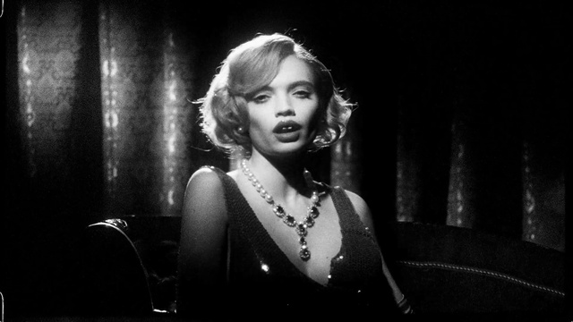 Video Reference: Flash photography, Black-and-white, Style, Music, Necklace, Music artist, Entertainment, Monochrome photography, Event, Jewellery