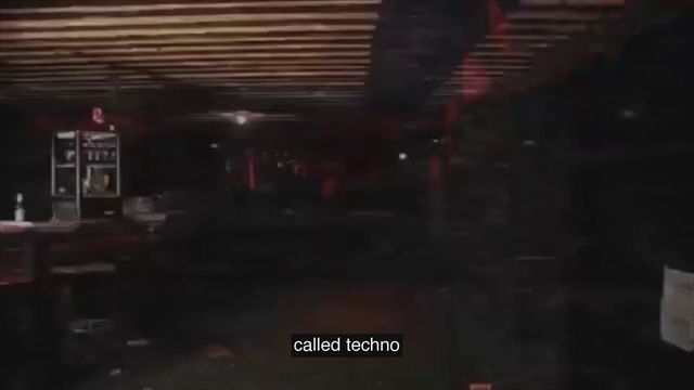 Video Reference: Black, Darkness, Light, Night, Mode of transport, Snapshot, Line, Screenshot, Sky, Midnight, Window, Train, Sitting, Track, Large, Street, Man, Kitchen, Table, Red, Station, Parked, Standing, Room, Bus, Truck, City, Sign, Text