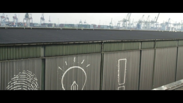 Video Reference: Roof, Wall, Architecture, Urban area, Fence, Facade, Asphalt, Vehicle, Building