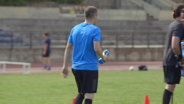 Video Reference: blue, player, football player, sport venue, sports, team sport, team, ball game, soccer player, sports training