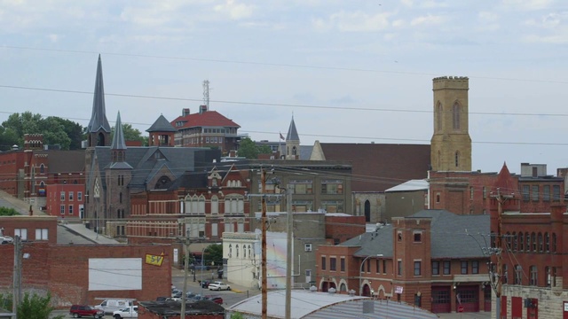 Video Reference: Town, Urban area, Neighbourhood, City, Building, Human settlement, Roof, Residential area, Sky, Architecture