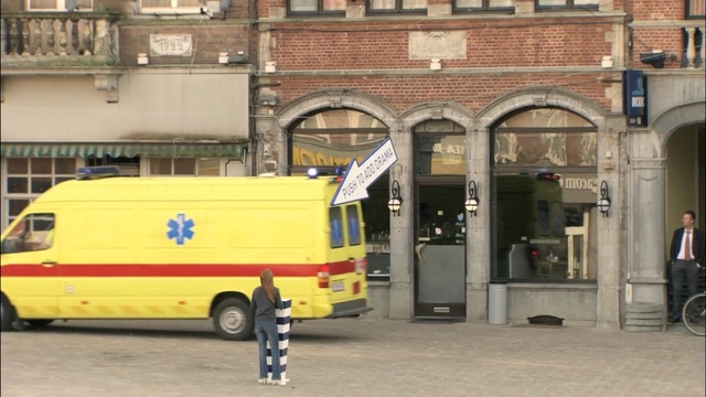 Video Reference: motor vehicle, vehicle, transport, car, mode of transport, metropolitan area, emergency vehicle, street, facade, building, Person