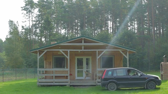Video Reference: House, Property, Car, Vehicle, Roof, Home, Log cabin, Cottage, Building, Shed
