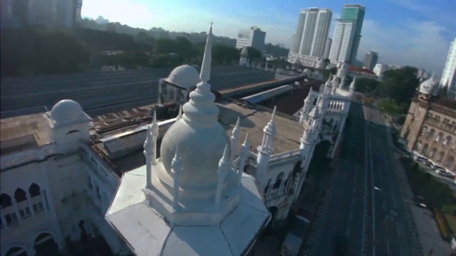 Video Reference: Landmark, Roof, Architecture, City, Metropolis, Metropolitan area, Tourist attraction, Vehicle, Aerial photography, Skyscraper