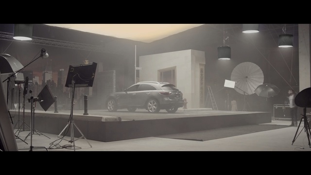 Video Reference: black, film studio, photography, black and white, design, interior design, glass, darkness, space, furniture, Person