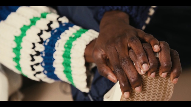 Video Reference: Hand, Finger, Nail, Headgear, Musical instrument, Wool