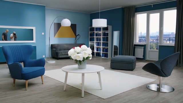 Video Reference: room, living room, interior design, furniture, table, chair, home, window, floor, suite, Person