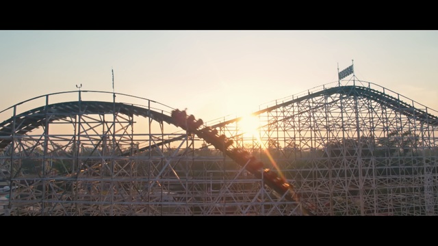 Video Reference: amusement ride, amusement park, roller coaster, landmark, sky, tourist attraction, structure, recreation, park