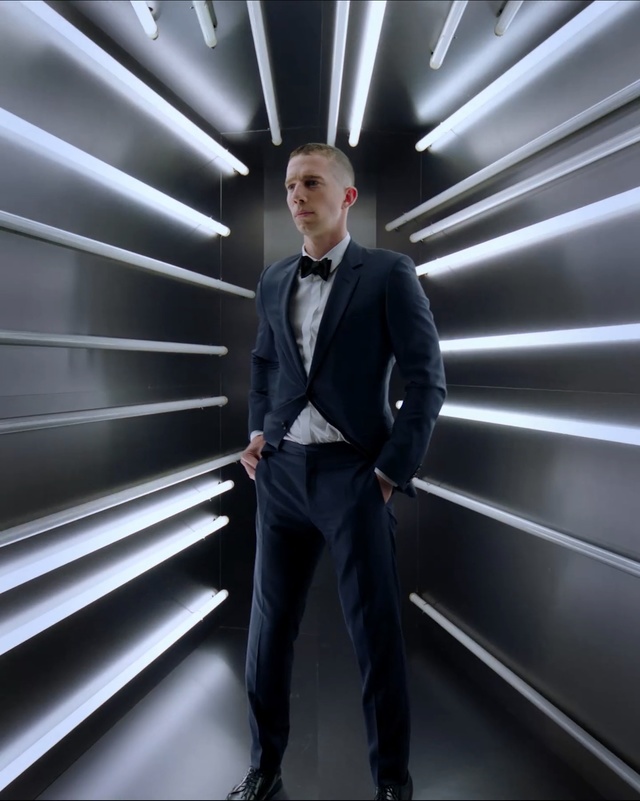 Video Reference: Suit, Standing, Formal wear, Gentleman, Male, Fashion, White-collar worker, Businessperson, Tuxedo, Photography, Person