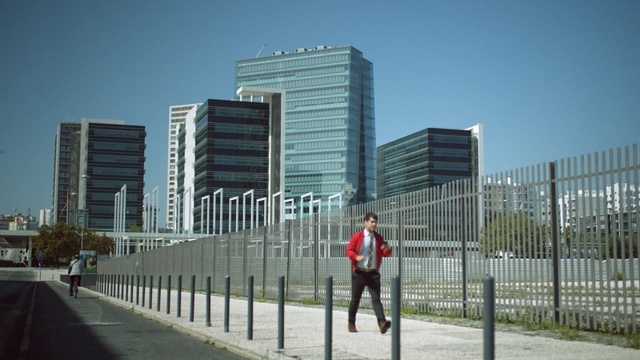 Video Reference: urban area, building, tower block, city, infrastructure, metropolitan area, residential area, town, skyscraper, architecture, Person