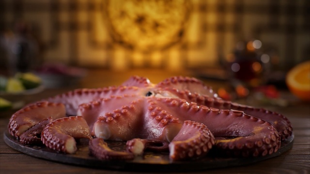 Video Reference: Octopus, giant pacific octopus, Cephalopod, Food, Marine invertebrates, Organism, Cuisine, Flesh, Dish, Meat, Person