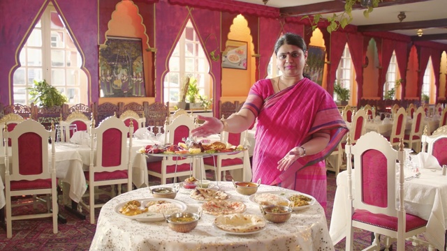 Video Reference: Function hall, Pink, Decoration, Tablecloth, Event, Furniture, Person