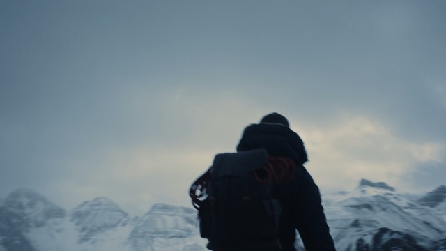 Video Reference: sky, mountainous landforms, cloud, mountaineering, ridge, mountain, mountain range, mountaineer, winter, adventure, Person