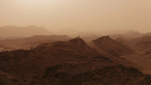 Video Reference: Mountainous landforms, Highland, Atmospheric phenomenon, Mountain, Hill, Sky, Wadi, Ridge, Mountain range, Haze