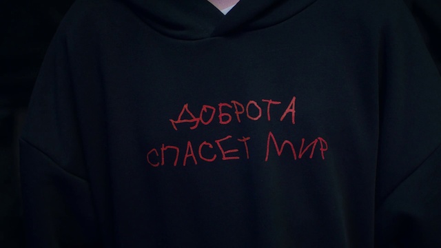 Video Reference: Hoodie, Clothing, Black, Outerwear, T-shirt, Text, Hood, Font, Sleeve, Sweatshirt