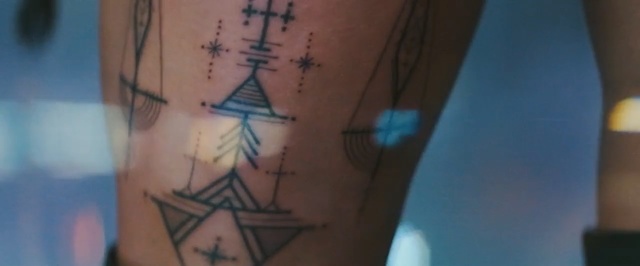 Video Reference: blue, tattoo, arm, back, close up, design, hand, muscle, finger, chest, Person