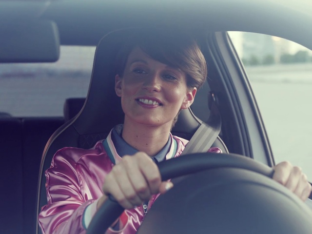 Video Reference: Face, Facial expression, Vehicle door, Driving, Head, Smile, Steering wheel, Fun, Cool, Vehicle