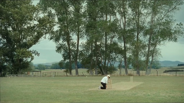 Video Reference: tree, grass, lawn, pasture, leisure, golf club, land lot, park, golf course, recreation, Person