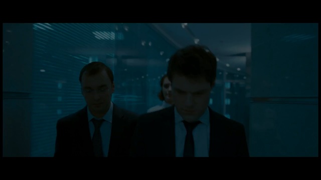 Video Reference: Blue, Movie, Screenshot, Azure, Darkness, Human, Fun, Design, Scene, Space, Person, Man, Indoor, Screen, Front, Monitor, Looking, Table, Photo, Television, Dark, Holding, Water, Standing, Laptop, Room, Computer, Woman, Large, White, Red, Bus, People, Suit, Human face, Text, Clothing