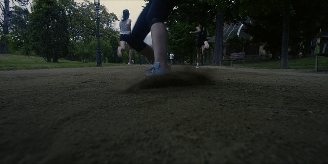 Video Reference: Recreation, Skateboard, Grass, Sports equipment, Skateboarding equipment, Photography, Sports, Individual sports, Soil, Boardsport, Outdoor, Man, Young, Riding, Air, Jumping, Boy, Game, Board, Flying, Park, Black, Doing, Wearing, Throwing, Trick, Holding, Hat, Baseball, Standing, Playing, Dirt, Street, Tree, Ground, Sky, Footwear, Person, Clothing, Woman, Dance