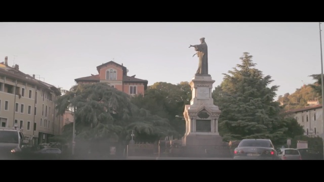 Video Reference: landmark, town, monument, tree, sky, urban area, residential area, statue, city, plaza, Person