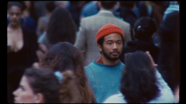 Video Reference: People, Crowd, Audience, Human, Beanie, Headgear, Event, Beard, Facial hair, Smile