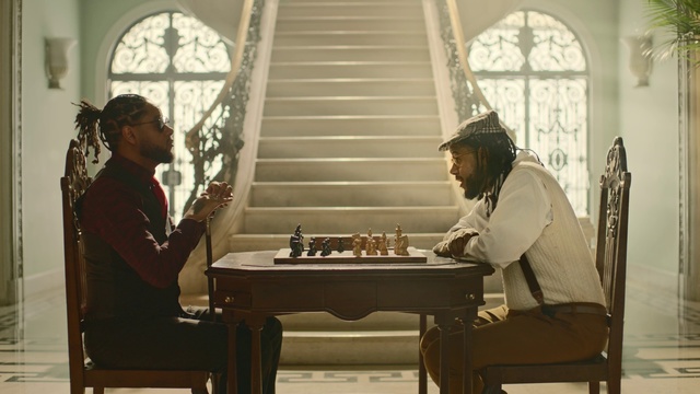 Video Reference: Games, Chess, Indoor games and sports, Board game, Chessboard, Tabletop game, Table, Recreation, Room, Furniture, Person, Indoor, Window, Woman, Sitting, Chair, Front, Man, Mirror, Standing, White, People, Wall, Dining table