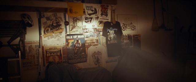 Video Reference: Wall, Text, Art, Font, Room, Architecture, Visual arts, Photography, Tourist attraction, Illustration, Indoor, Area, Lot, Covered, Filled, Bed, Lit, Dark, Table, Living, Many, Night, White, Bedroom, Person, Cartoon, Handwriting, Poster, Clothing