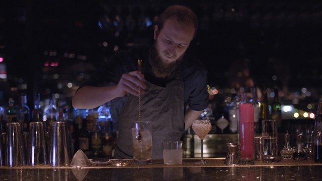 Video Reference: drink, distilled beverage, liqueur, alcoholic beverage, bar, alcohol, bartender, night, darkness, club