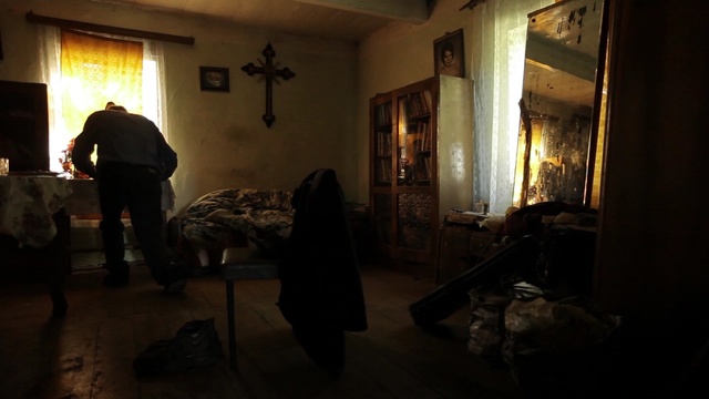 Video Reference: room, darkness, tourist attraction, house, window, night, interior design, Person