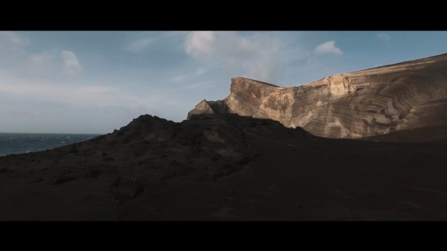 Video Reference: sky, cliff, rock, horizon, sea, terrain, badlands, geological phenomenon, coast, mountain