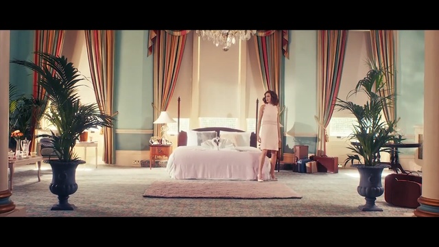 Video Reference: room, furniture, home, ceremony, interior design, function hall, window, table, wedding reception, living room, Person