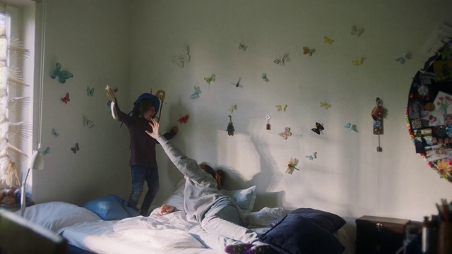 Video Reference: Bed, Wall, Room, Bedroom, Bed sheet, Joint, Leg, Textile, Wallpaper, Plaster, Person