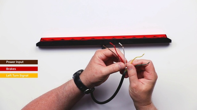 Video Reference: Finger, Hand, Wire, Thumb, Cable, Person, Holding, Using, Man, Red, Small, Yellow, Sitting, Wearing, Woman, Table, Cutting, Video, Remote, White, Boat, Phone, Text