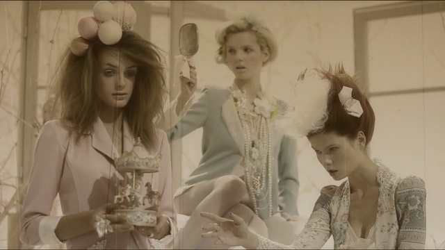 Video Reference: Photograph, Lady, Vintage clothing, Fashion, Hairstyle, Headpiece, Doll, Photography, Fashion design, Hair accessory, Person, Woman, Wedding, Photo, Standing, Posing, Couple, Girl, Young, Man, Sitting, Dress, White, Holding, Cake, Dressed, Hair, Mirror, Black, Old, People, Table, Group, Shirt, Train, Wall, Human face, Clothing, Wedding dress, Fashion accessory