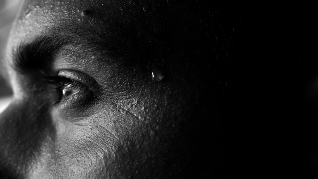 Video Reference: Face, Black, Eye, Nose, Eyebrow, Close-up, Skin, Head, Black-and-white, Organ