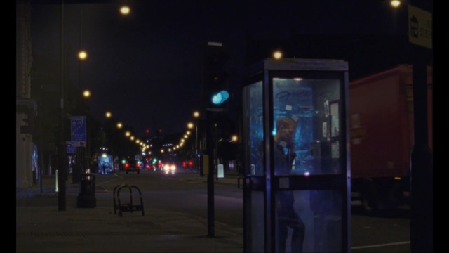Video Reference: night, street light, light, light fixture, darkness, lighting, city, sky, evening, downtown, Person