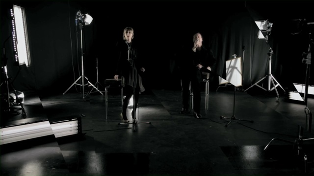 Video Reference: stage, performance, darkness, performance art, black and white, musical instrument accessory, string instrument, scene, film studio, audio