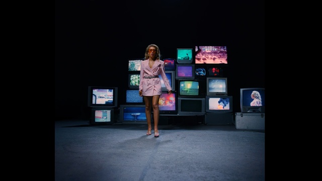 Video Reference: screen, television, person, computer, cheering, lights, nighttime, background