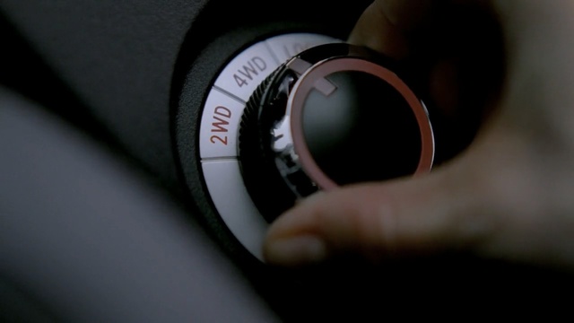 Video Reference: car, camera lens, close up, vehicle, photography, automotive design, lens, macro photography, gear shift, camera, Person