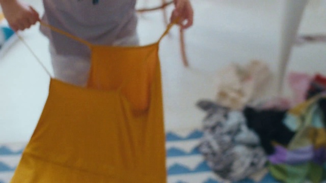 Video Reference: Yellow, Clothing, Dress, Textile, Pattern, T-shirt, Pattern, Person