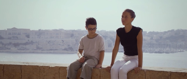 Video Reference: photograph, vacation, sky, fun, sitting, standing, girl, summer, sea, tourism, Person