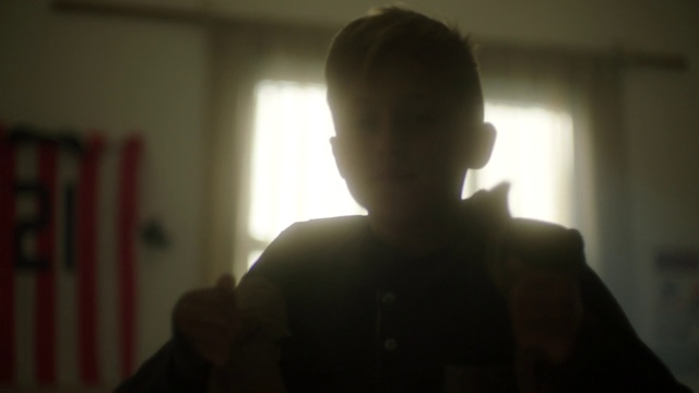 Video Reference: White, Hair, Face, Photograph, Black, Facial hair, Light, Head, Shoulder, Standing