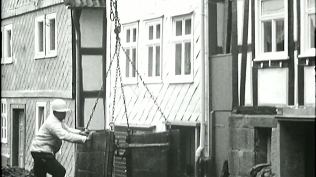 Video Reference: black and white, photograph, monochrome photography, urban area, photography, architecture, structure, residential area, vehicle, monochrome, Person