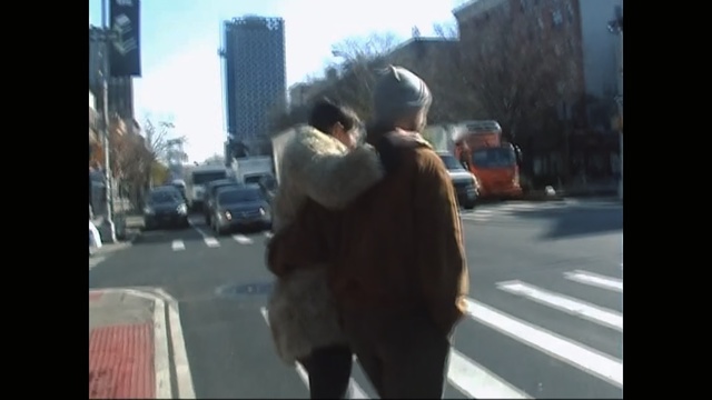 Video Reference: photograph, mammal, mode of transport, interaction, street, snapshot, emotion, girl, pedestrian, road, Person